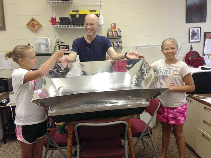 Twins with SOP Director Rick Jost and their solar oven.