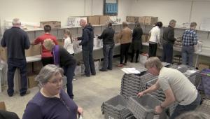 PACH volunteers packing backpacks