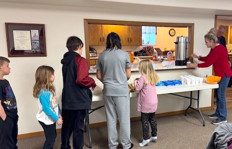 Kids getting after school snacks.