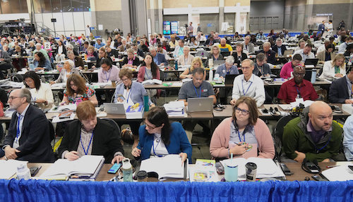 Delegates sitting at tables