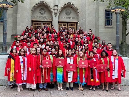 Graduating class in red robes