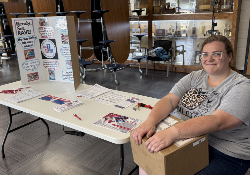 woman sitting at display table