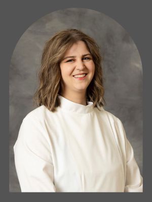 Pastor in white robe