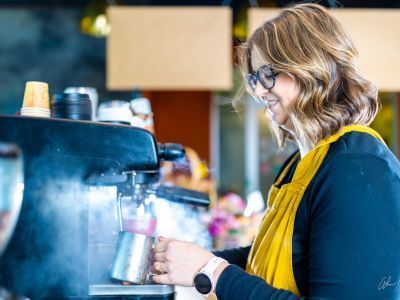 Woman making espresso