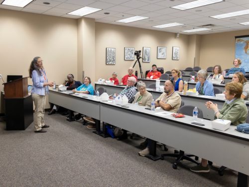 Group listening to woman presenting