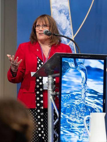 Woman at podium