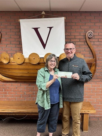 two people holding check