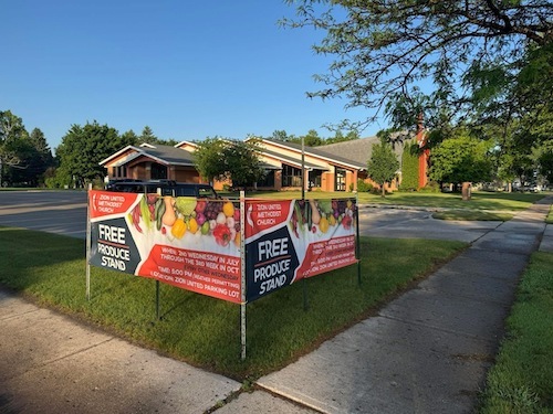 Yard signs about free produce stand
