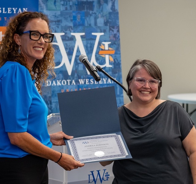 Two persons with certificate