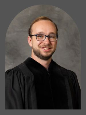 man in black robe