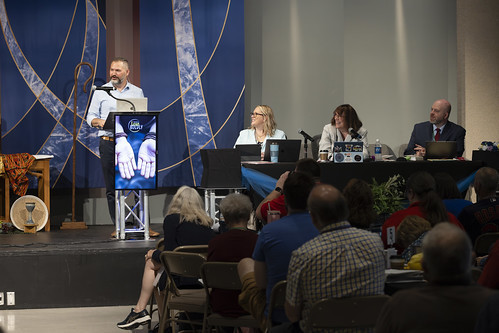 Pastor at podium with audience