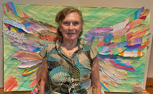 Woman standing by wings
