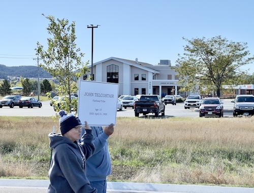 Walkers holding placard
