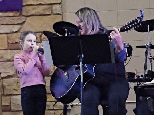 woman and girl singing
