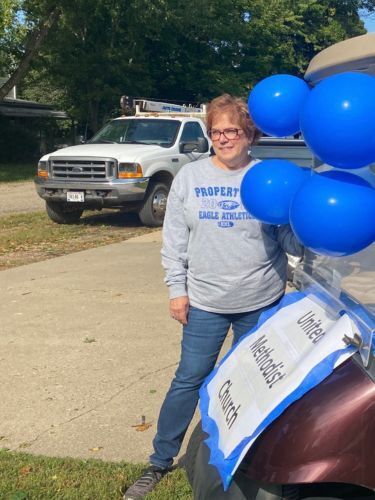woman standing with balloons