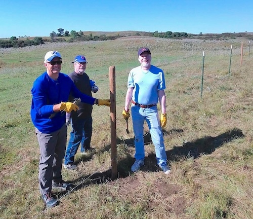 Fence-mending volunteers.