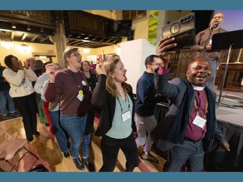 Celebratory dance at Leadership Gathering
